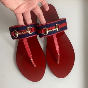 Red and navy blue toe thong sandals with horse-bit detail